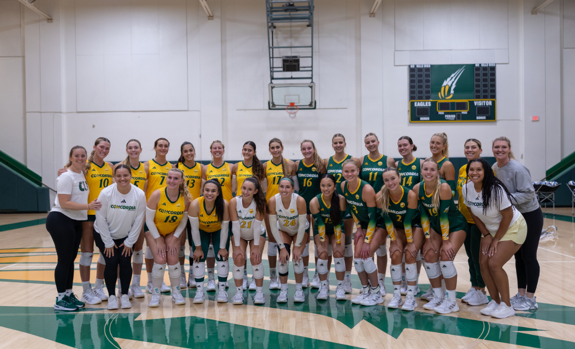 Women's Volleyball posing for a picture after their green vs. gold scrimmage.